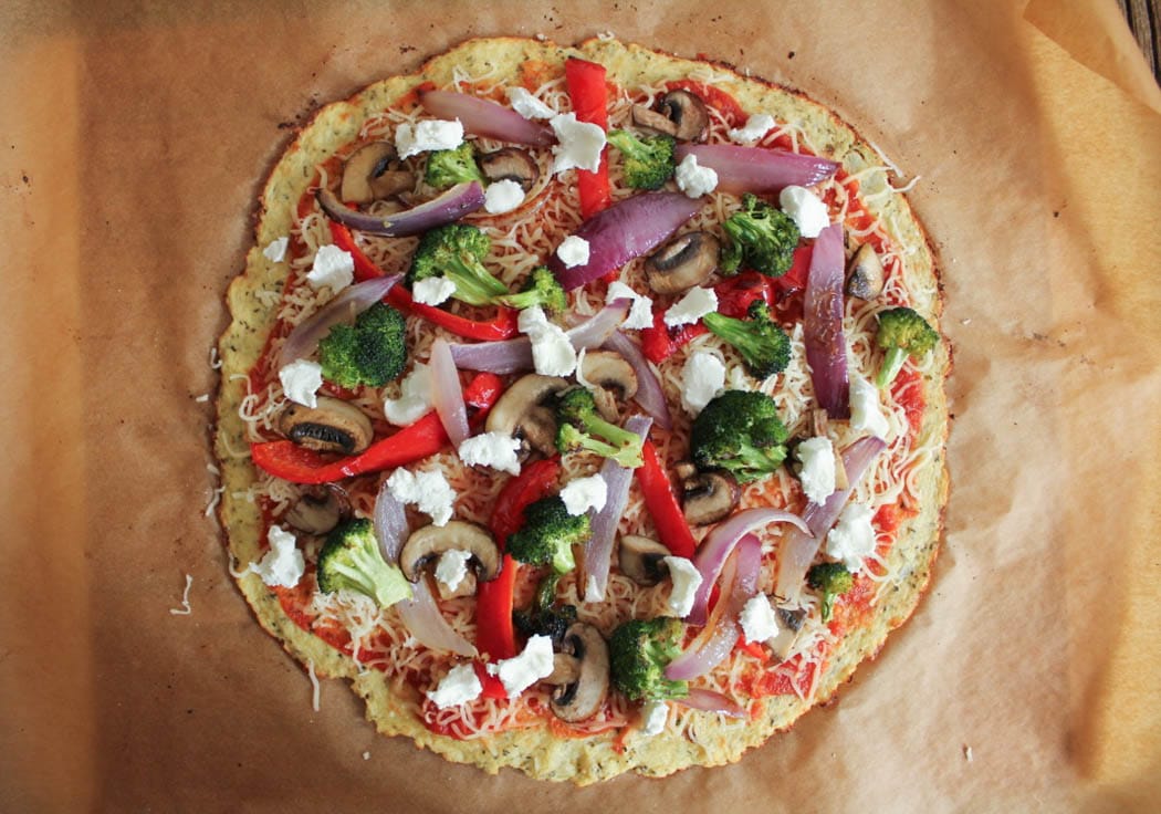 Cauliflower Pizza with Roasted Vegetables and Goat Cheese about to go in the oven