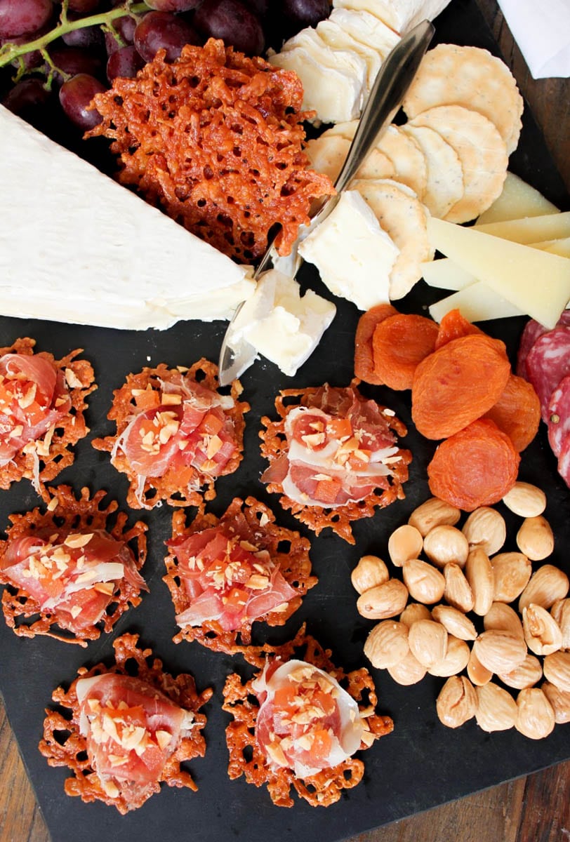 Manchengo-crisps-with-serrano-ham-quince-paste-and-marcona-almonds