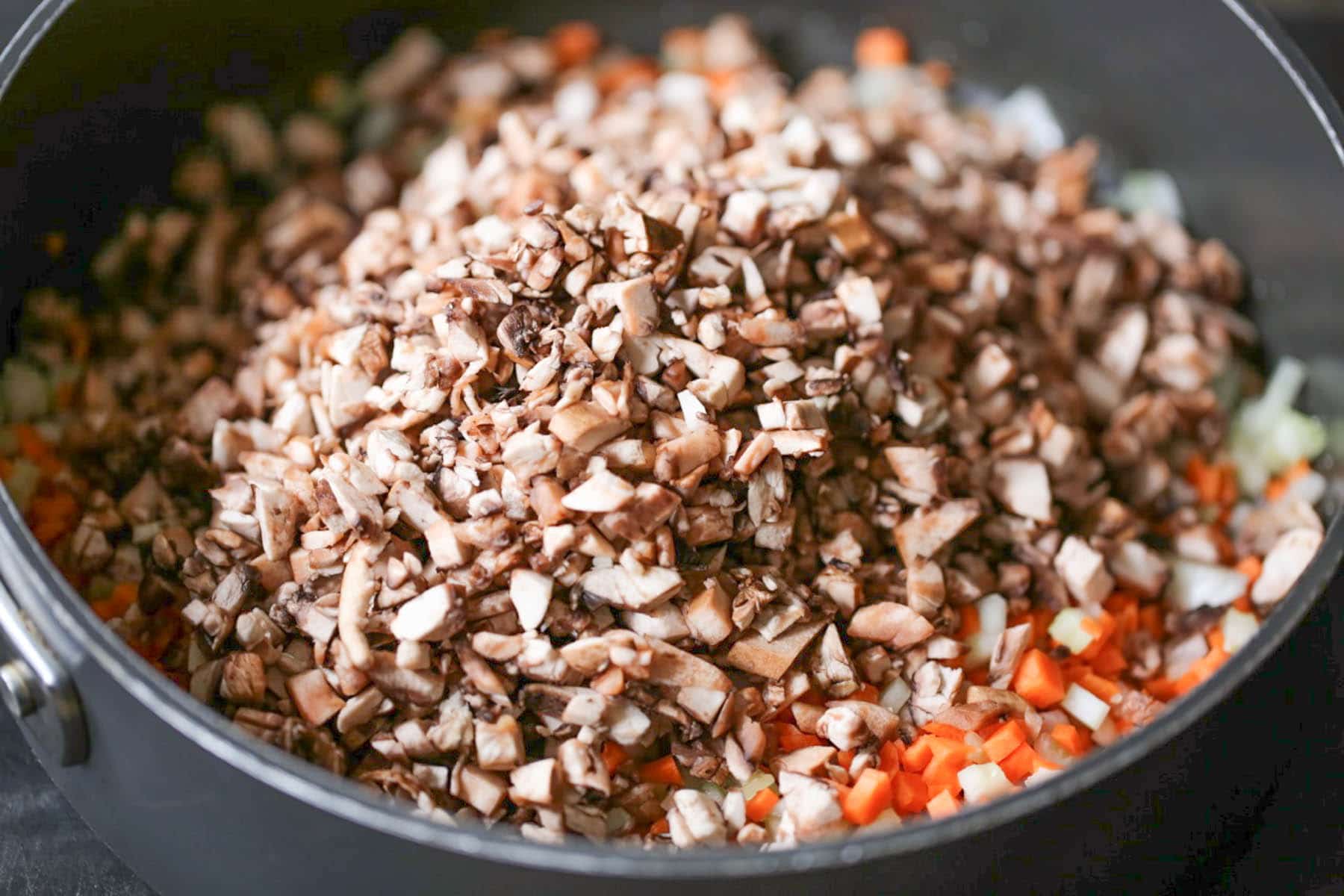 Vegetables in a saute pan for portobello bolognese sauce.