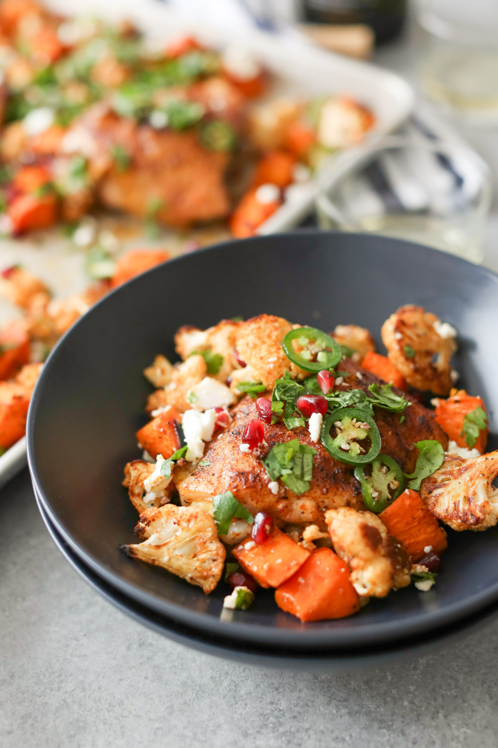 Sheet Pan Chicken Thighs with Cauliflower, Sweet Potatoes, and Pomegranate